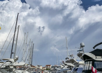 Wind (Bora, Jugo, Bura, Nevera / Neverin, Maestral), weather in the Adriatic Sea and Croatian Islands. A thunderstorm is moving over a marina.