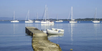 Shopping by dinghy: bay with anchored yachts